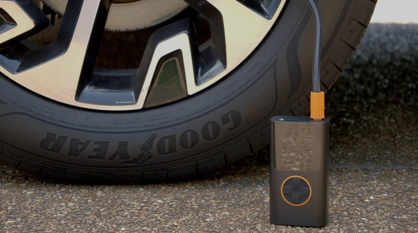 The real GloveBox Air Pro connected to a car tire outside