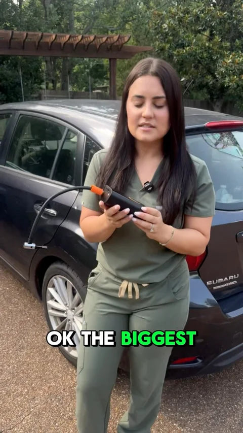A GloveBox Air creator demonstrating the inflator beside a car